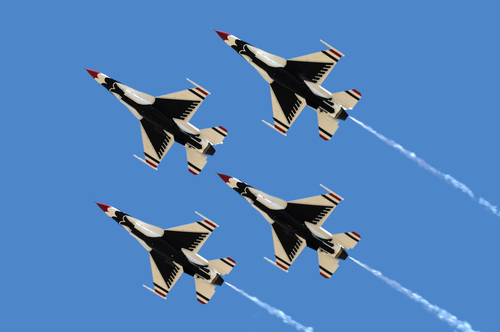 shutterstock_27216235.jpg Four military jets flying in formation against a clear blue sky
