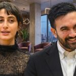 Millions FLEE After Mayor’s Shocking Announcement… Two professionals engaged in conversation in a modern office setting