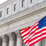Explosive $1.25M MILITARY Bribery Scandal EXPOSED… United States courthouse with American flag waving.