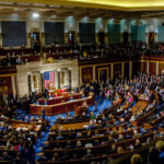 Congressional meeting in session with members seated in chambers.
