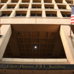 Hunter’s BLAME Game: Israel Accused in Biden SAGA! Exterior view of the J. Edgar Hoover FBI Building with American flags