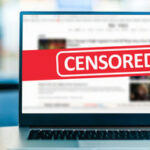 DOJ Targets UCLA in Antisemitism Crackdown Laptop screen with CENSORED banner over webpage
