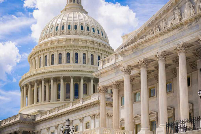 1222901443 U.S. Capitol dome with blue sky background.