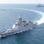 Pentagon Burns BILLIONS — China SMILES Warships maneuvering at sea, leaving a white wake.
