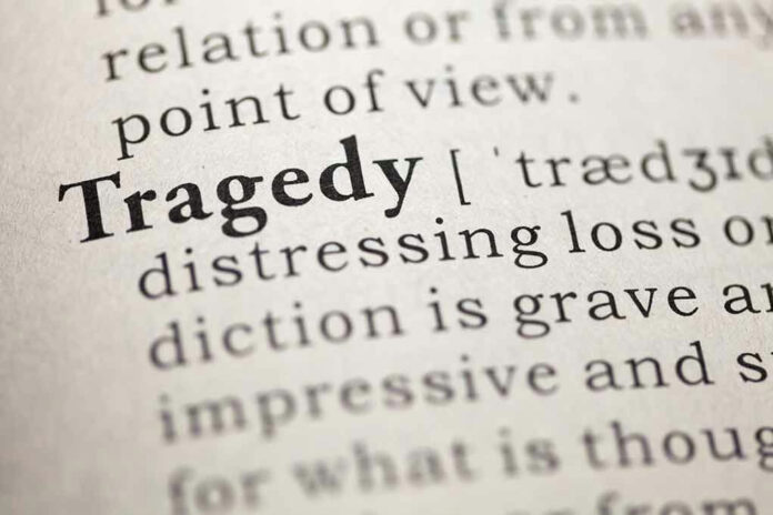 Close-up of the word Tragedy in a dictionary