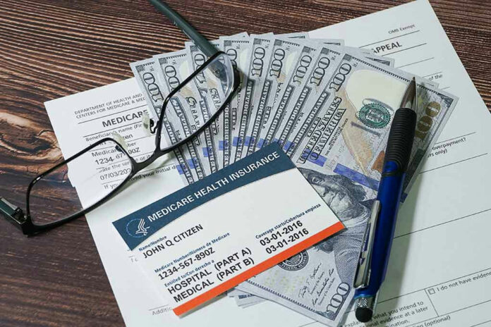 2248274327-1 Medicare card with cash, documents, glasses, and pen.