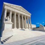 SERIOUS Court POWER GRAB Looms Supreme Court building with columns and statues.