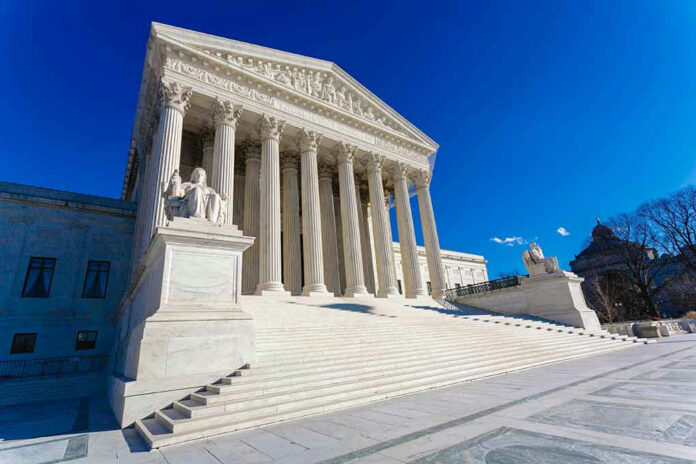 376063027 Supreme Court building with columns and statues.