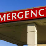 ANOTHER MASS SHOOTING — Six Shot, ZERO Clarity — What Happened? Red and white Emergency sign outside building.