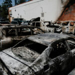 Courtroom Battle Sparks New Liberty Concerns Burned cars in a parking lot after a fire