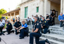 FEDS Drop 94-Page EXPLOSION — This is MASSIVE! Police officers kneeling on steps, some wearing face masks.