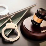 Federal Judge ARRESTED Over Parking-Lot Meltdown Gavel, handcuffs, and legal books on a dark surface.
