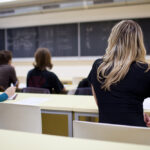 UCLA Fellowship Sparks New Immigration Debate Students seated in a classroom listening to a teacher at the chalkboard