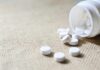 Washington Heights Drug Market Raises Alarm White tablets spilling from a plastic bottle
