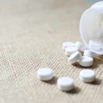 Washington Heights Drug Market Raises Alarm White tablets spilling from a plastic bottle