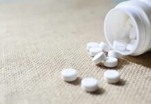 Washington Heights Drug Market Raises Alarm White tablets spilling from a plastic bottle