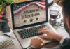 Person using laptop displaying midterm election screen