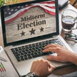 Musk Fires Up The Midterm Machine Again Person using laptop displaying midterm election screen