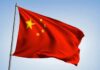 Chinese national flag waving on a pole