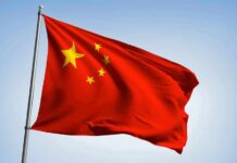 Chinese national flag waving on a pole