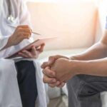 Doctor-Ordered Ketamine—Career Obliterated? Doctor consulting a patient on a sofa