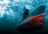 Submarine underwater with light filtering from the surface.