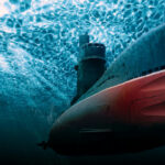 Submarine underwater with light filtering from the surface.
