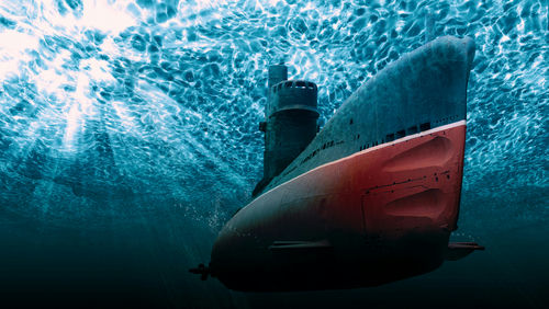 Submarine underwater with light filtering from the surface.