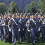 Warfighter First: Classrooms Face Brutal Cut military cadets marching in formation with rifles
