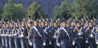 military cadets marching in formation with rifles