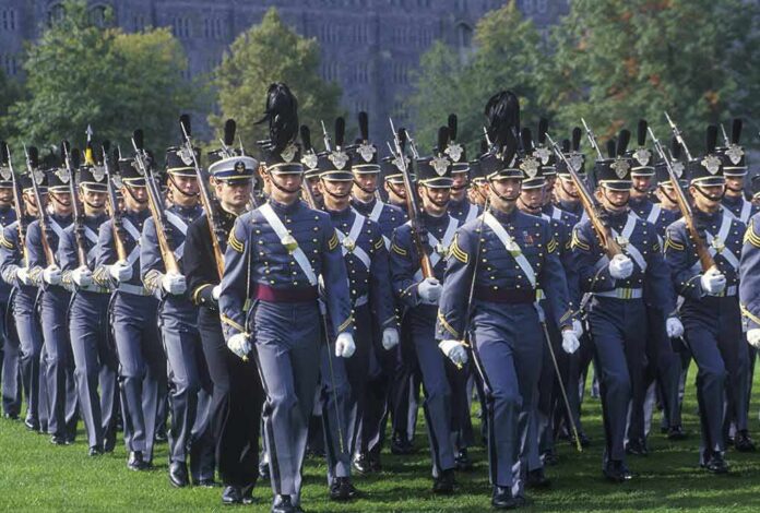 military cadets marching in formation with rifles