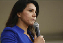 One Word Sparks An Intelligence Loyalty Test Woman in blue blazer holding a microphone.