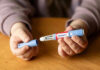 Ozempic-Style Drugs May Quiet More Than Hunger Hands holding an Ozempic injection pen.