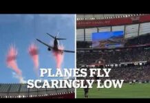 Moment two airliners nearly hit packed stadium in 'dangerous' pre-game flyover is caught on camera