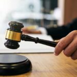 Model’s Meltdown Upends Coachella Heist Case Judge's hand holding a gavel over a sound block