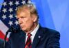 CNN Star Torches Trump — What Crossed the Line? man at podium speaking into microphone