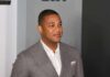 Church Showdown: Lemon’s Journalism Defense man in gray suit smiling at event
