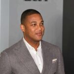 Church Showdown: Lemon’s Journalism Defense man in gray suit smiling at event