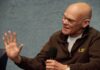 Carville Warns Democrats Face A ‘Schism’ Bald man speaking into a handheld microphone