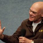 Carville Warns Democrats Face A ‘Schism’ Bald man speaking into a handheld microphone