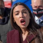 The Democratic Money Fight Goes Public woman speaking passionately at outdoor event
