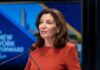 Hochul’s Mask Crackdown COLLAPSES in Court woman speaking at a podium with microphones