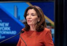 Hochul’s Mask Crackdown COLLAPSES in Court woman speaking at a podium with microphones