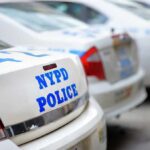 Pre-Dawn Manhole Stunt Sparks NYPD Hunt Row of NYPD police cars parked in a line