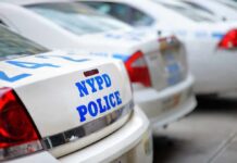 Pre-Dawn Manhole Stunt Sparks NYPD Hunt Row of NYPD police cars parked in a line