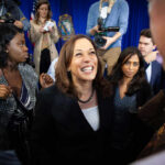 Kamala Harris smiling among supporters with Maya Harris nearby