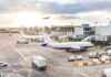 One Flight Triggered a Full-Blown Security Scare Airplanes at airport gates during sunset with ground vehicles and jet bridges