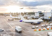 One Flight Triggered a Full-Blown Security Scare Airplanes at airport gates during sunset with ground vehicles and jet bridges
