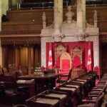 Throne chairs in ornate parliamentary chamber