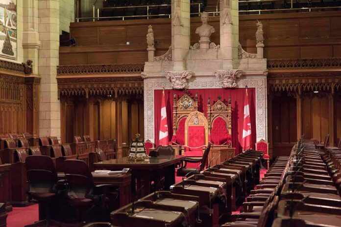 shutterstock_1139205482 Throne chairs in ornate parliamentary chamber
